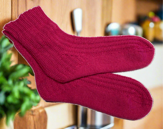 Pair of sock knitted in Truly Wool Rich 4-ply Raspberry